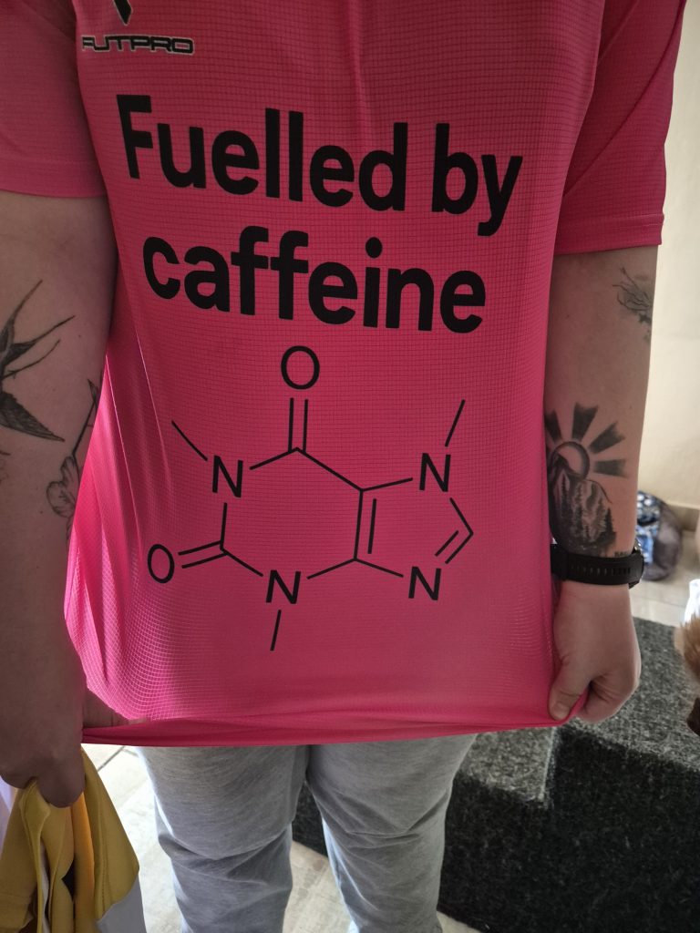 Pink T-shirt with a caffeine-themed print