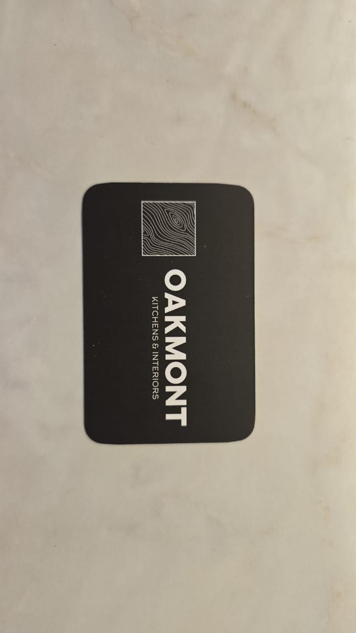 Black rectangular branded label on a light product surface