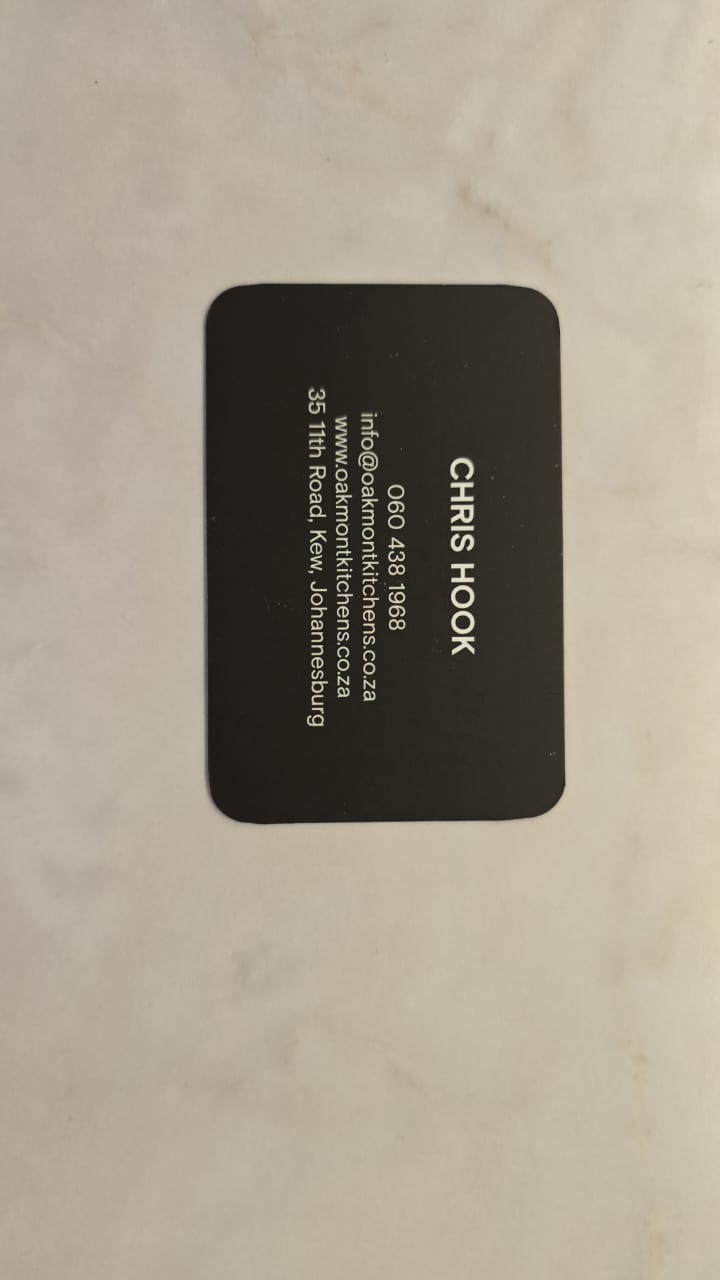 Black rectangular branded label on a light product surface