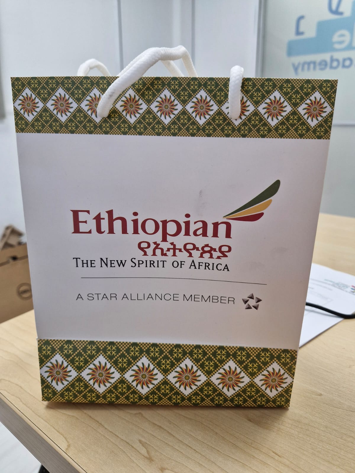 Client-supplied printed corporate gift bag with a patterned branded design