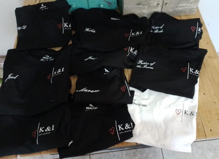Black and white branded polo shirts arranged together