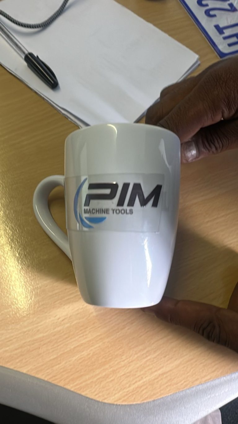 White mug printed with a corporate logo
