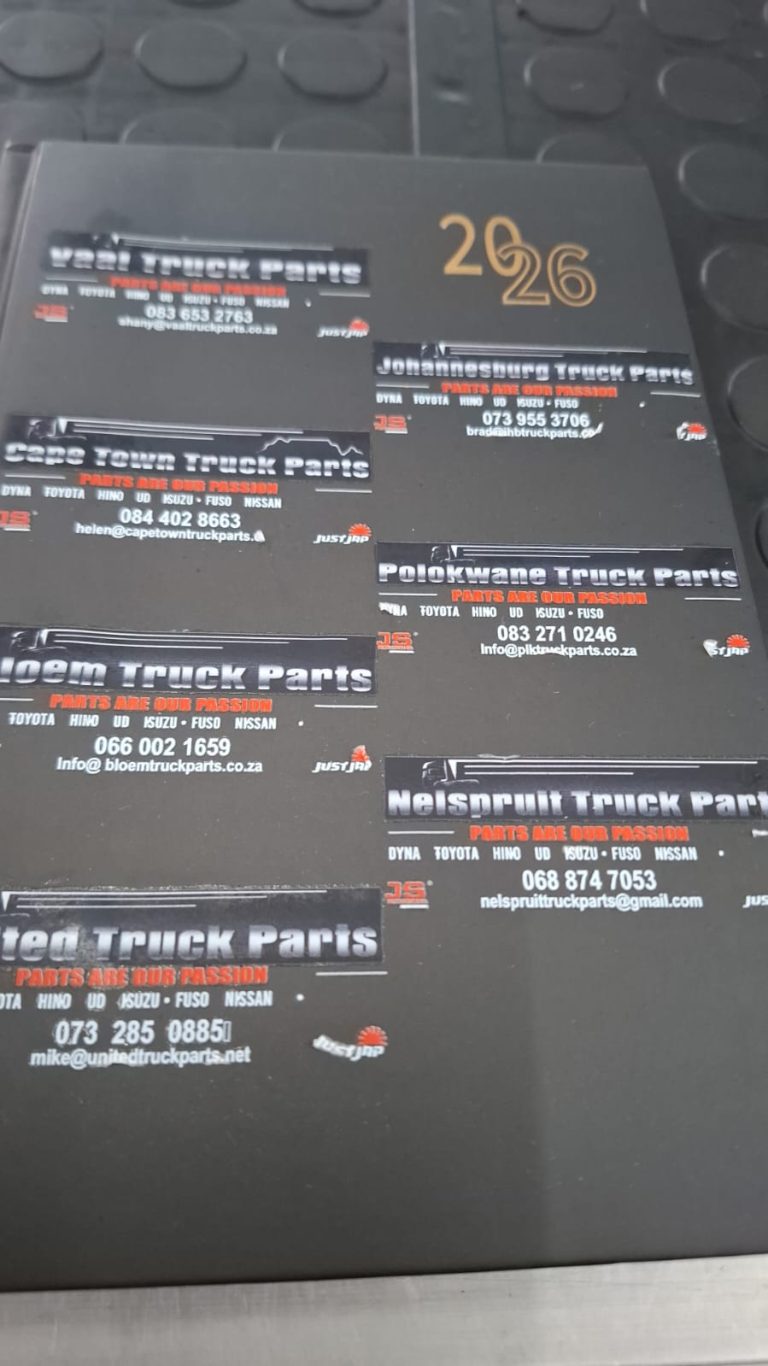 Stack of black promotional flyers with red and white details