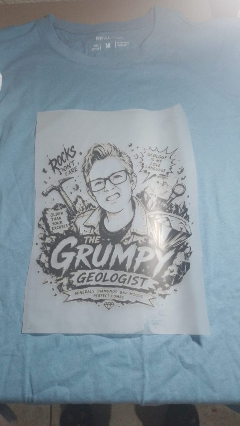 Light blue T-shirt with a monochrome character print