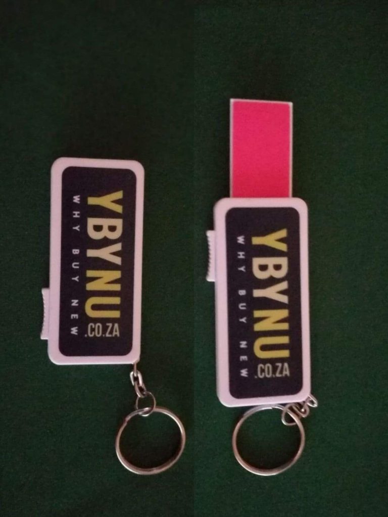Two pink and black branded keyrings