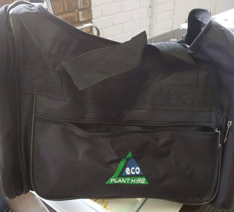 Black shoulder bag with a green embroidered logo