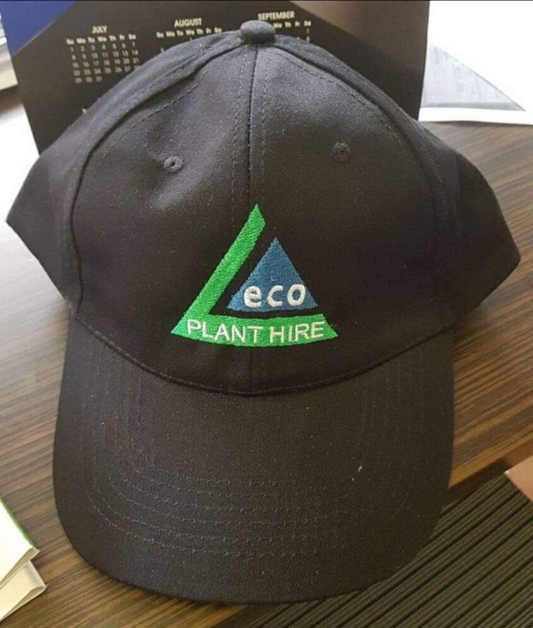 Black cap with a green embroidered logo