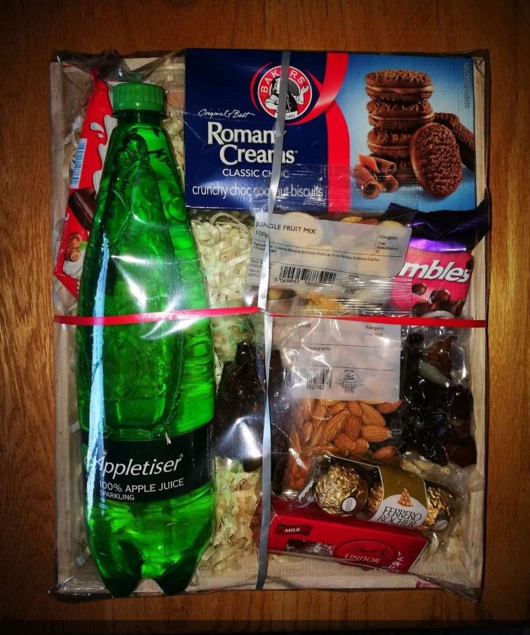 Boxed corporate gift hamper with snacks and drinkware