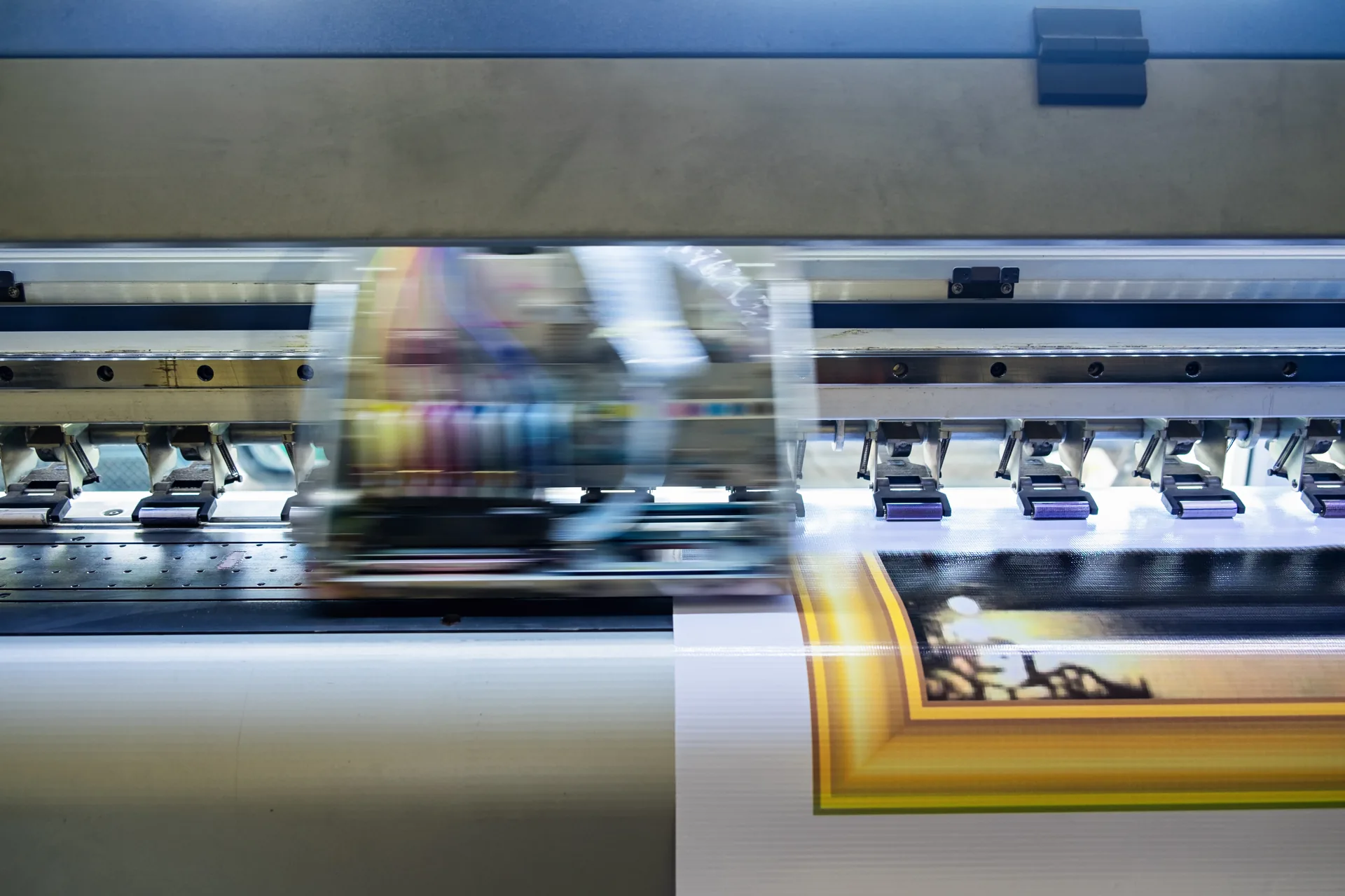 Wide-format printer producing a colourful vinyl print